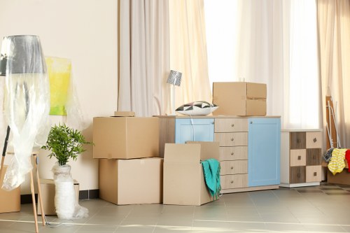 Local removal team preparing a move in Waterloo with boxes and furniture