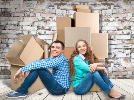 Professional movers handling furniture in a Waterloo property