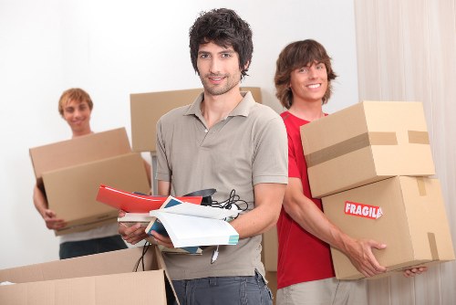 Careful loading of boxes and furniture into a removal van