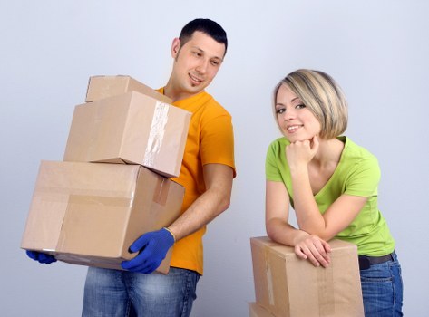 Packed moving boxes and a removal van for a Waterloo move